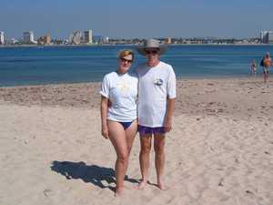 Sanding on the beach on Deer Island, with the Mazatlan skyline in the background